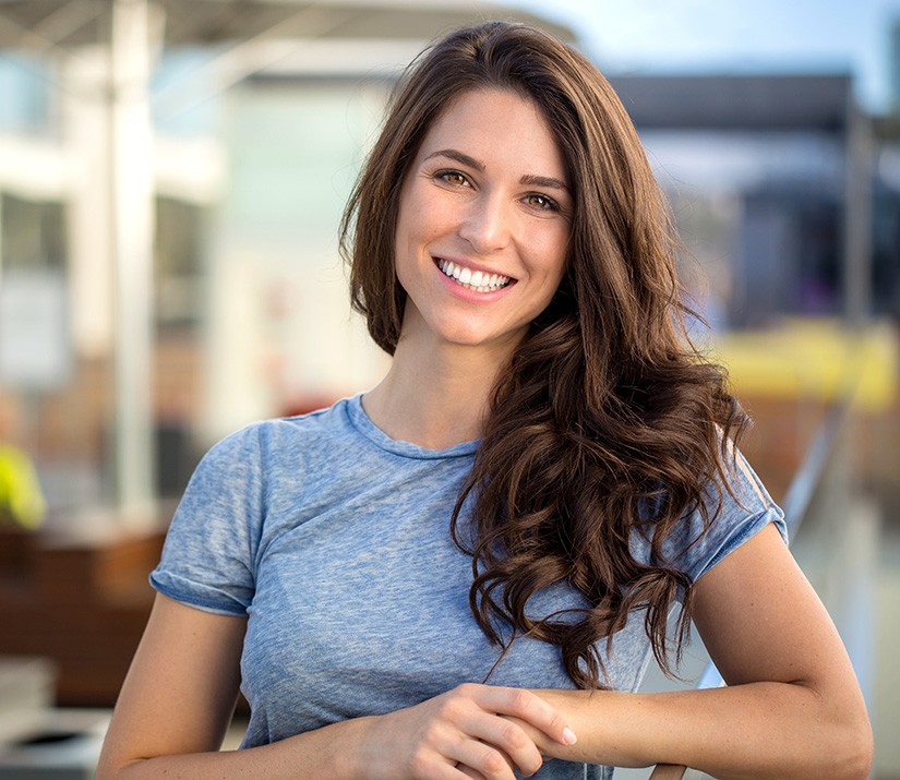 A happy, smiling middle-aged woman at home