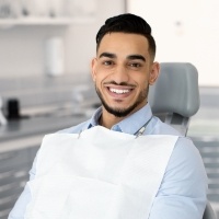Man smiling during dental exam and x-rays visit