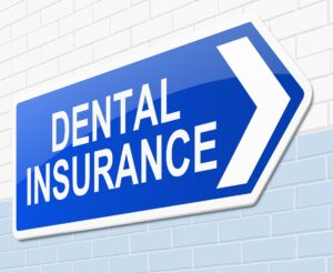 Dental insurance sign on a block wall